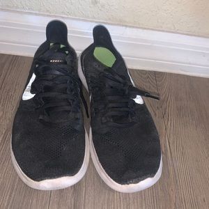 Black Nike fly knit running shoes